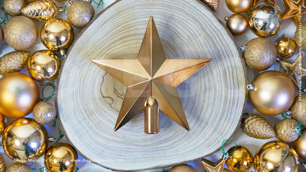 Christmas Golden Star on wooden log