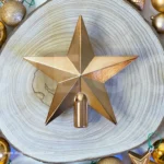 Christmas Golden Star on wooden log