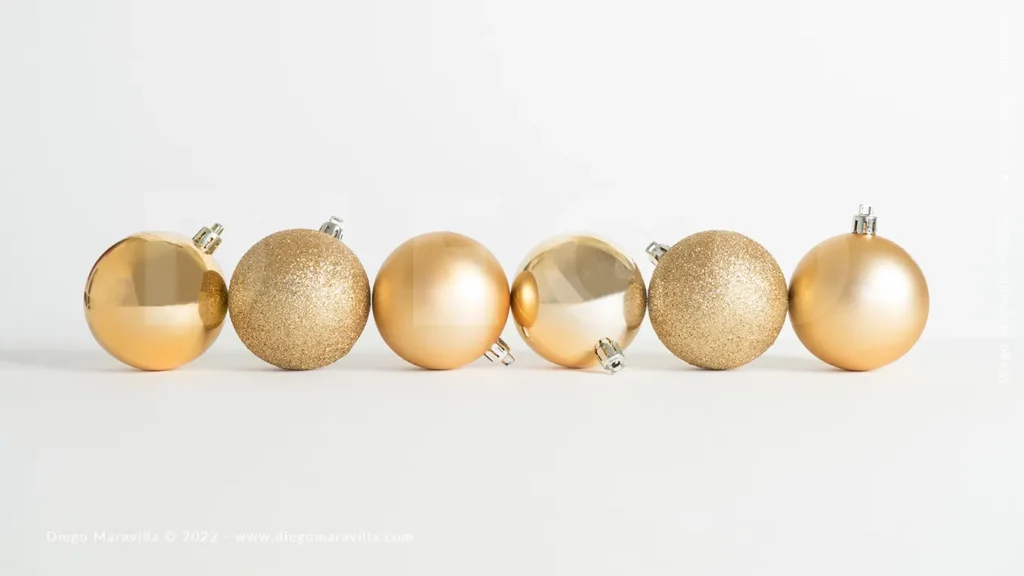 Christmas decorations, golden spheres on white background