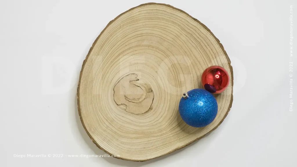wooden log with simple christmas decoration and white background